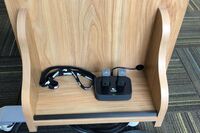 Pedestal - view of drawer showing two wireless mics in charging base