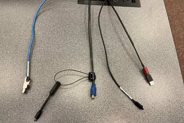 Pedestal - laptop cable connections with cables pulled out showing cable ends