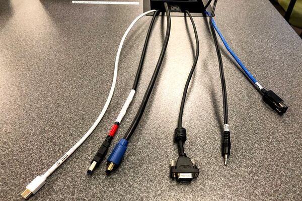 Pedestal - laptop cable connections with cables pulled out showing cable ends