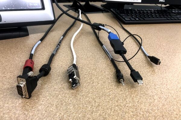 Pedestal - laptop cable connections with cables pulled out showing cable ends