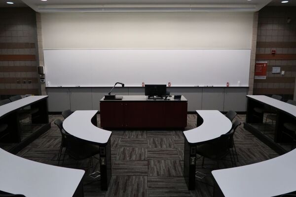 Front of room view with lectern center in front of markerboard 
