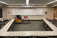 Room view with lectern and faculty table on left