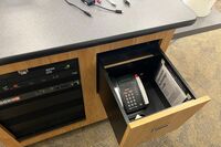 Pedestal - inside view of drawer showing telephone